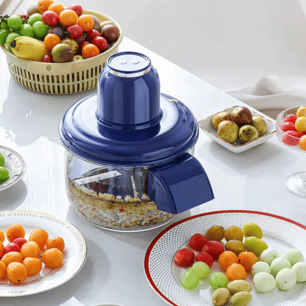 Hachoir electrique Haerto sur plan de travail avec fruits et legumes